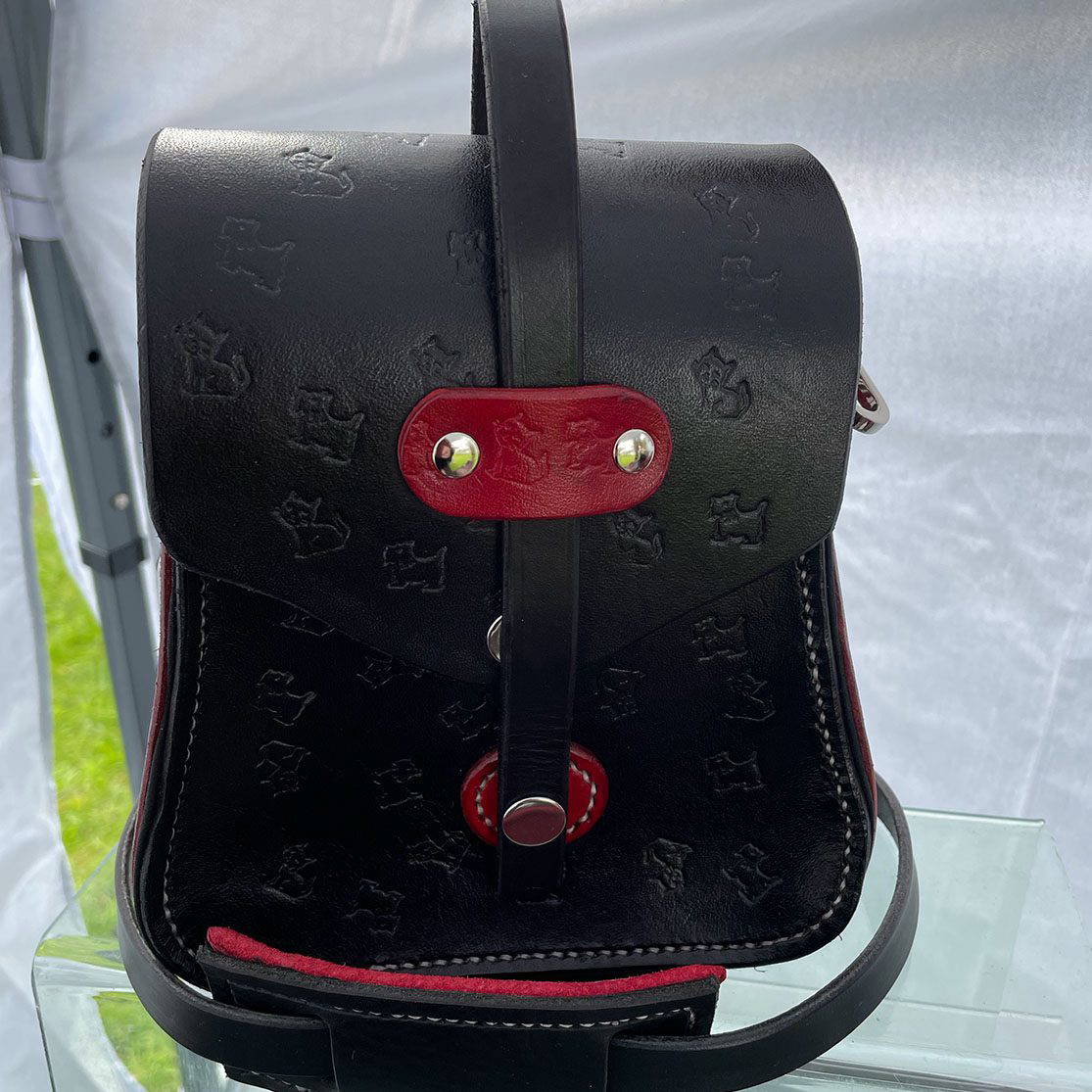 Bespoke made leather handbag with red details